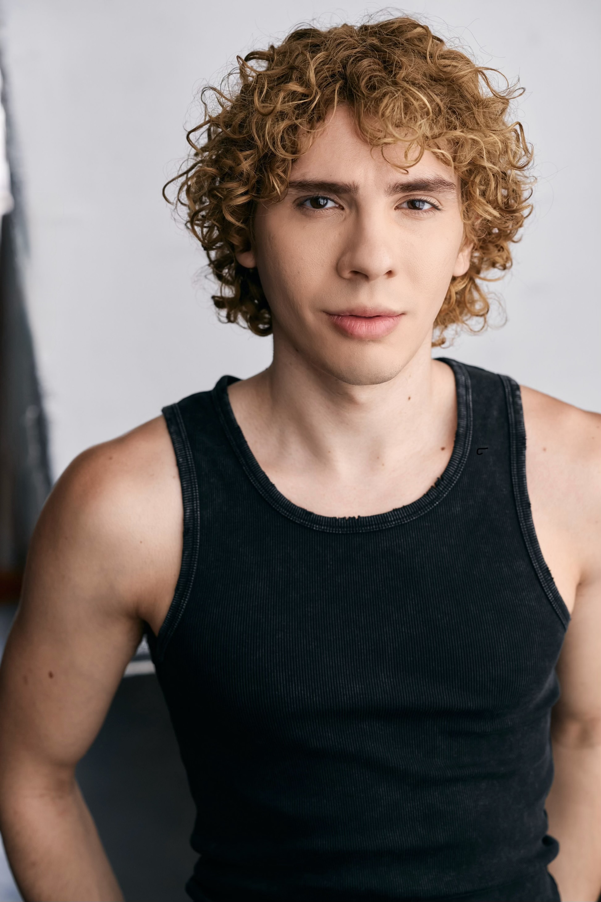 Caner Oz in a black tank top