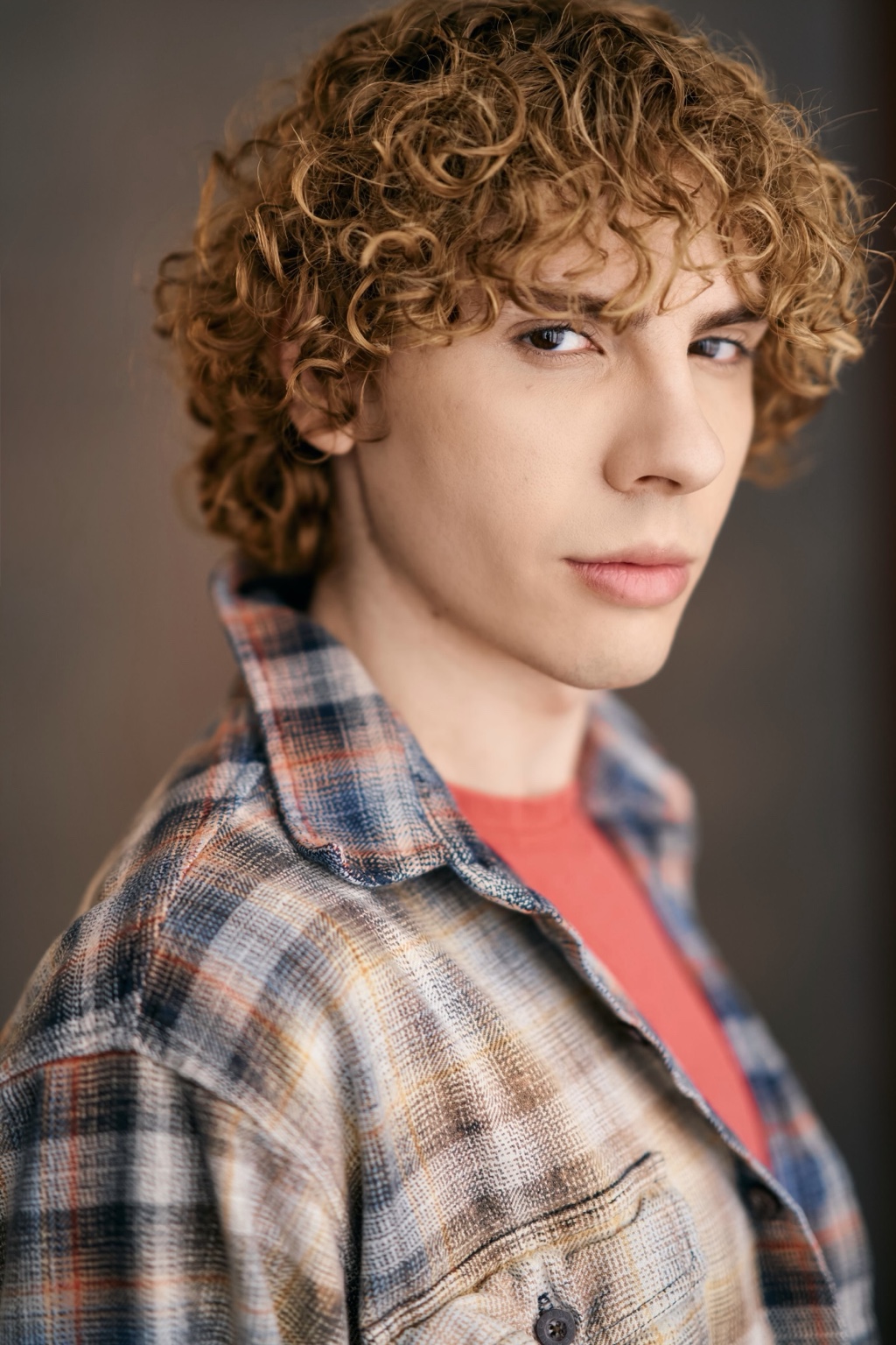 Caner Oz in a plaid overshirt